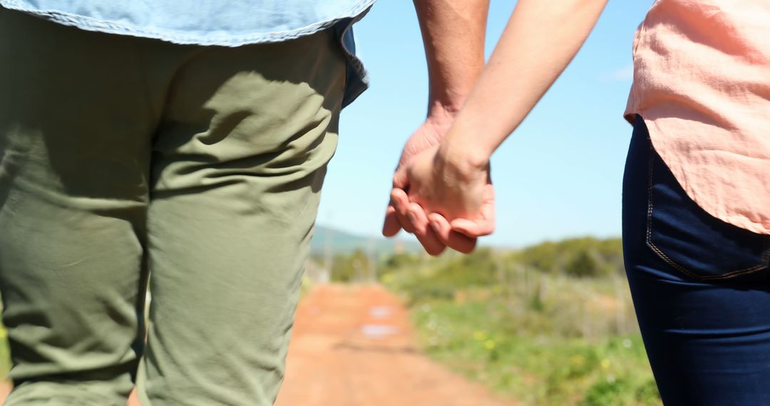 Caucasian couple holding hands outdoors, with copy space - Free Images, Stock Photos and Pictures on Pikwizard.com