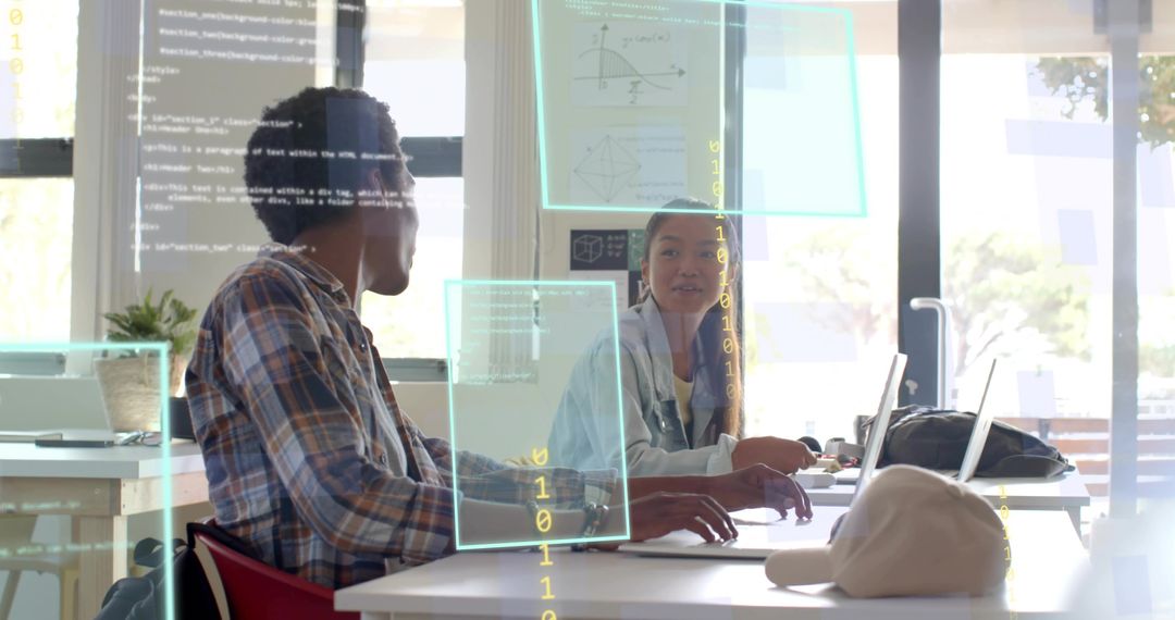 Collaborating on code in bright coworking hub with laptops and holographic overlays