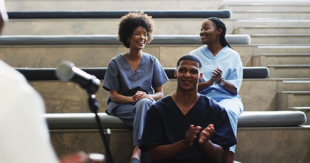 Enthusiastic Students Clapping in Lecture Hall Session