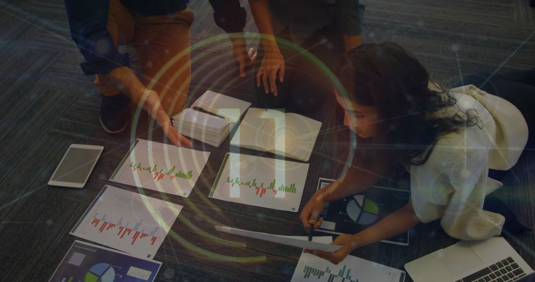 Colleagues Analyzing Data Spreadsheets in Office Meeting