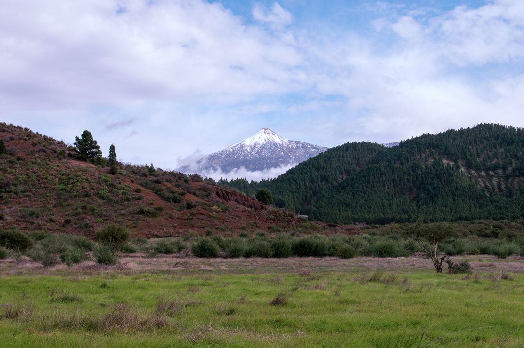 Scenic Mountain Landscape with Snow-Capped Peak and Green Valley - Free Images, Stock Photos and Pictures on Pikwizard.com