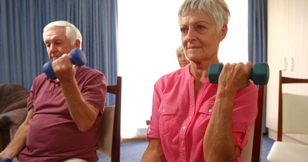 Seniors Engaging in Dumbbell Workout Routine at Home