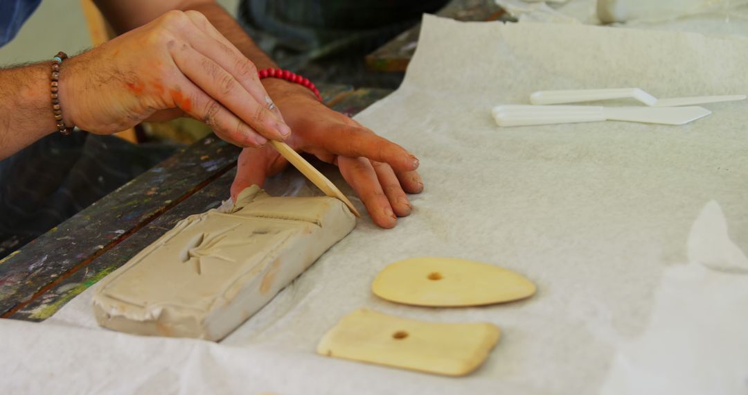 Artist Sculpting Clay in Design Studio Workshop - Free Images, Stock Photos and Pictures on Pikwizard.com