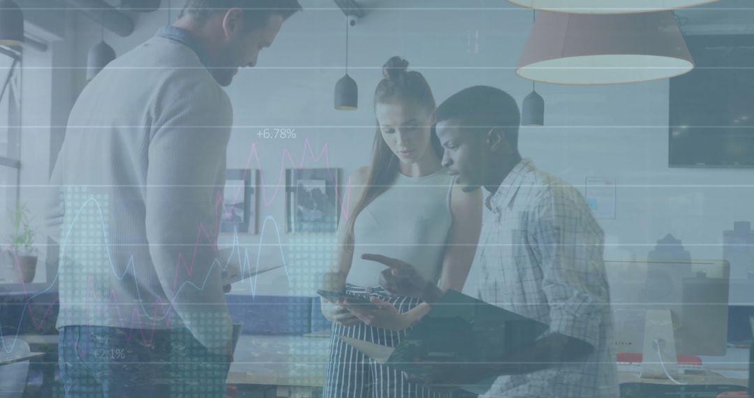 Multiracial Team Collaborating on Financial Analysis in Office