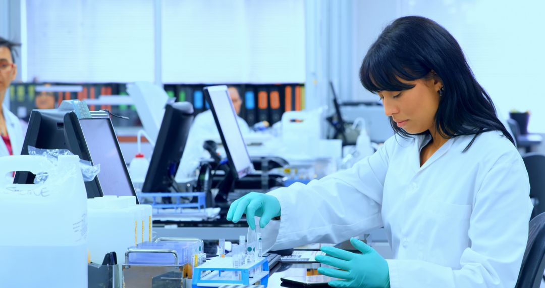 Female Scientist Working with Lab Equipment in Modern Laboratory Environment - Free Images, Stock Photos and Pictures on Pikwizard.com