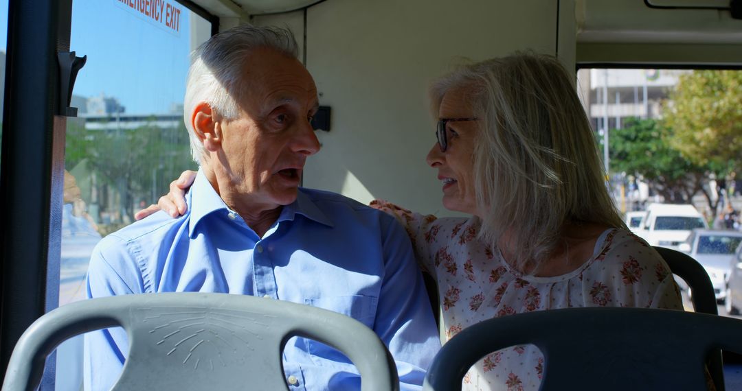 Senior Couple Embracing on City Bus Journey