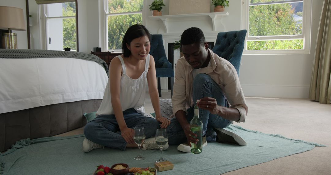 Couple Enjoying Wine and Conversation in Cozy Home Setting