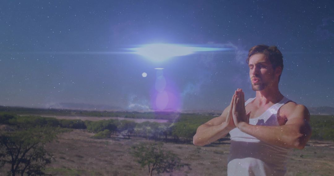 Man Practicing Mindfulness in Tranquil Desert Landscape Under Sky