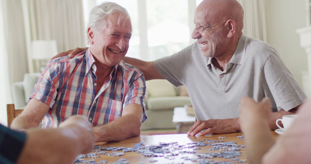 Senior Friends Enjoying Jigsaw Puzzle Together at Home - Free Images, Stock Photos and Pictures on Pikwizard.com