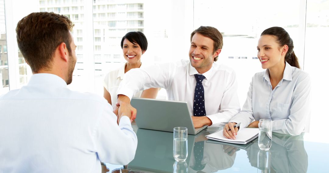 Confident Job Applicant Shaking Hands with Interview Panel