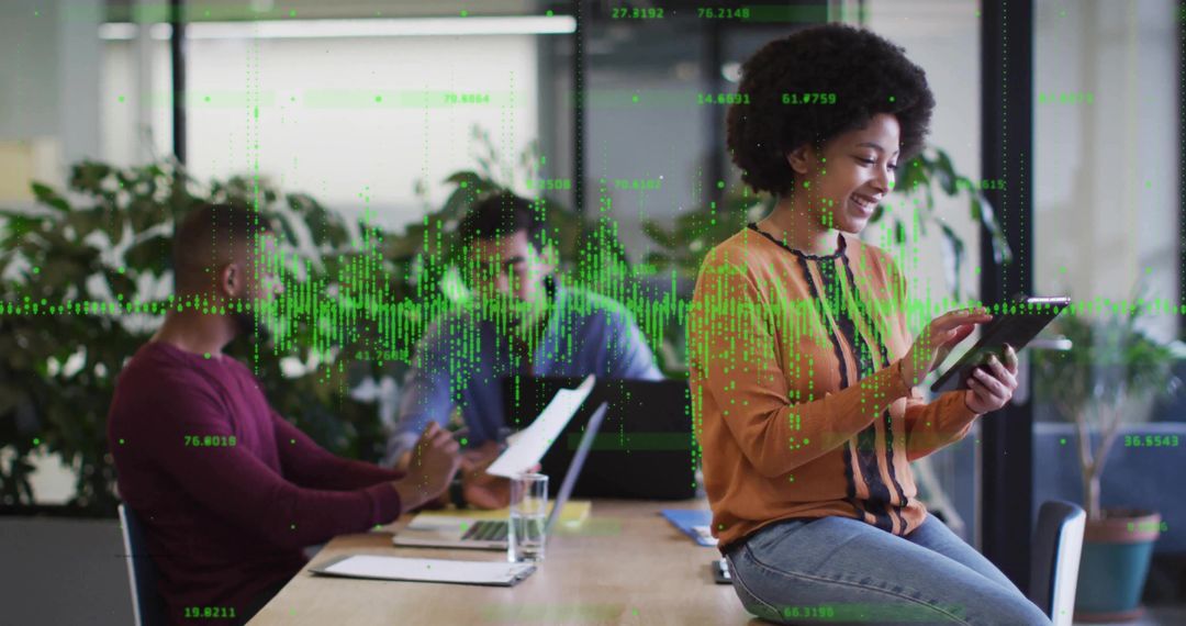 Businesswoman Analyzing Digital Data with Team in Office Environment