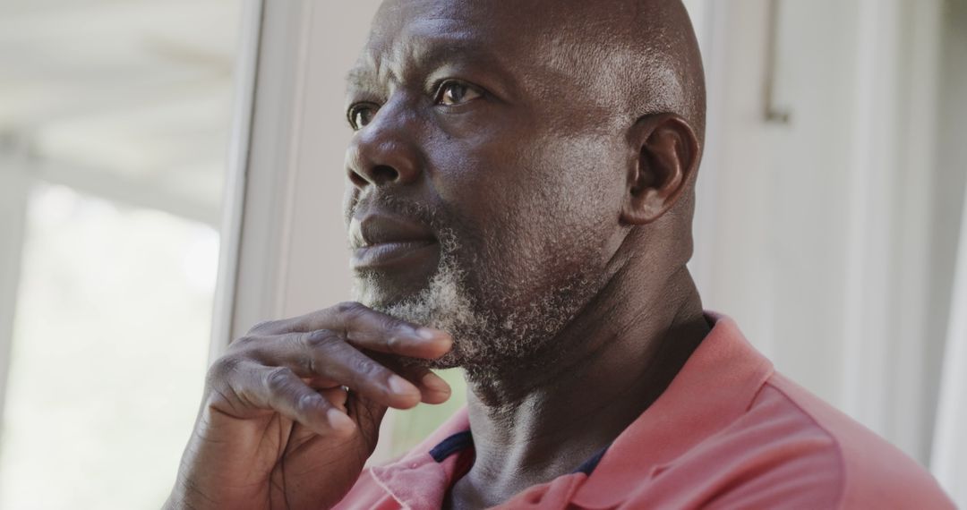 Thoughtful Senior Man Relaxing Indoors