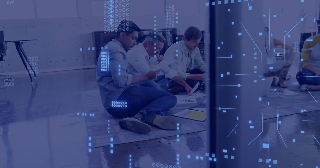 Team Analyzing Documents with Digital Overlay in Modern Office