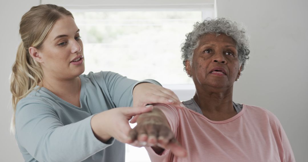 Woman Helping Senior with Physical Therapy Exercises - Free Images, Stock Photos and Pictures on Pikwizard.com