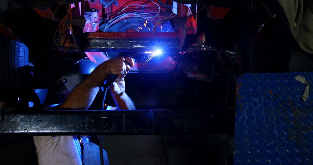 Automotive Mechanic Welding Car Undercarriage in Workshop - Free Images, Stock Photos and Pictures on Pikwizard.com