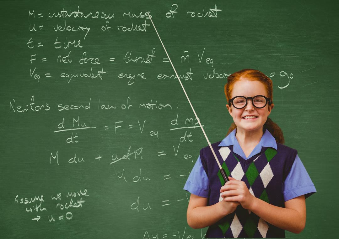 Portrait of a smiling girl standing in front of chalkboard - Free Images, Stock Photos and Pictures on Pikwizard.com