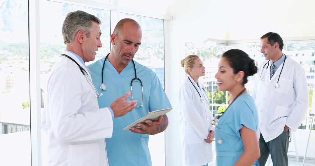 Medical Team in Discussion at Modern Hospital - Free Images, Stock Photos and Pictures on Pikwizard.com