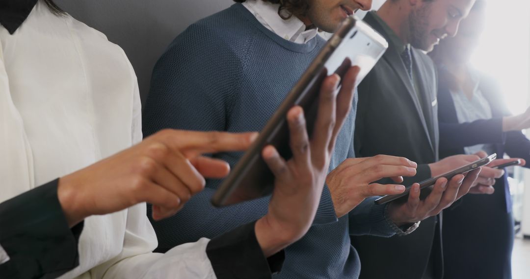 Diverse Group of Young Adults Engaged in Digital Devices