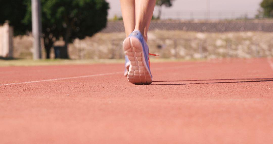 Runner's Feet in Sneakers on Track at Outdoor Stadium - Free Images, Stock Photos and Pictures on Pikwizard.com