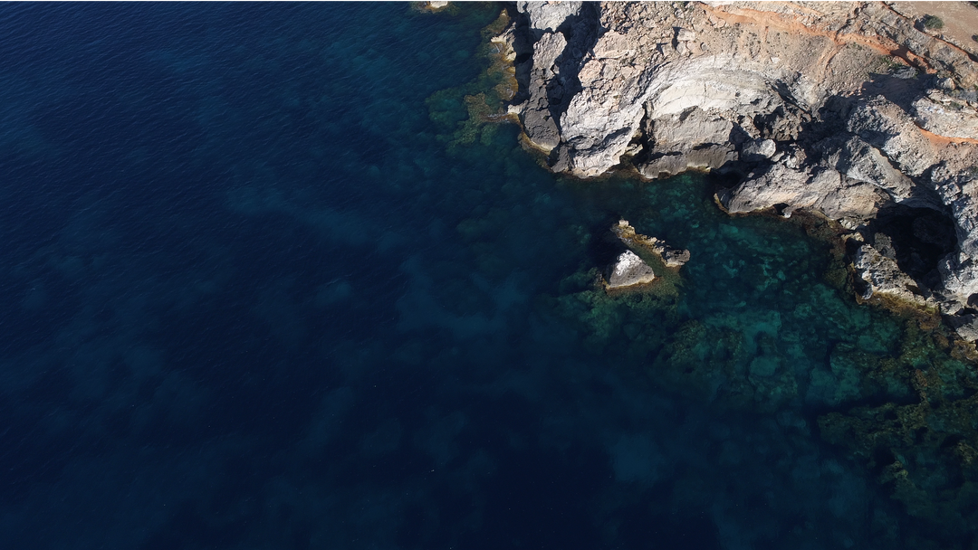 Transparent Waters by Rugged Cliff Seen from Above - Download Free Stock Images Pikwizard.com