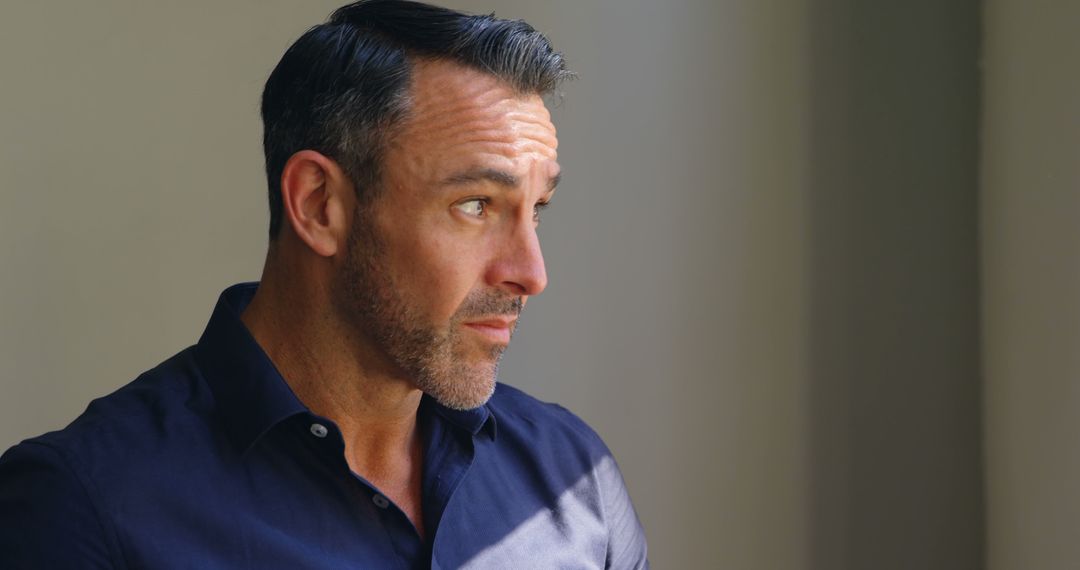 Pensive Middle-Aged Man Deep in Thought with Copy Space