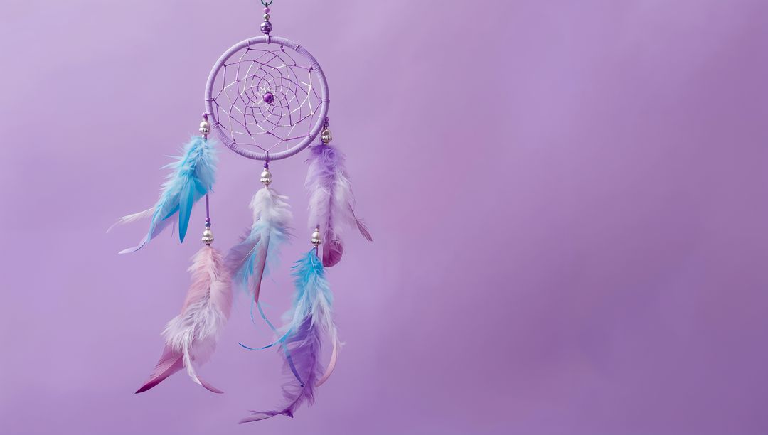 Boho Dreamcatcher with Pastel Feathers Against Lavender Background
