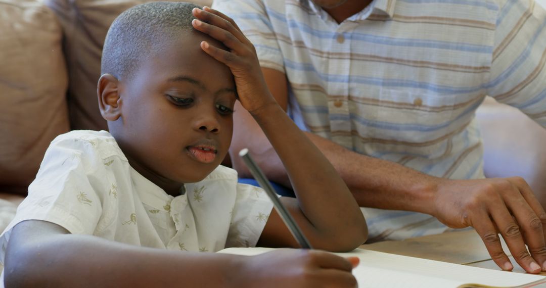 Young Boy Struggling with Homework while Parent Helping - Free Images, Stock Photos and Pictures on Pikwizard.com