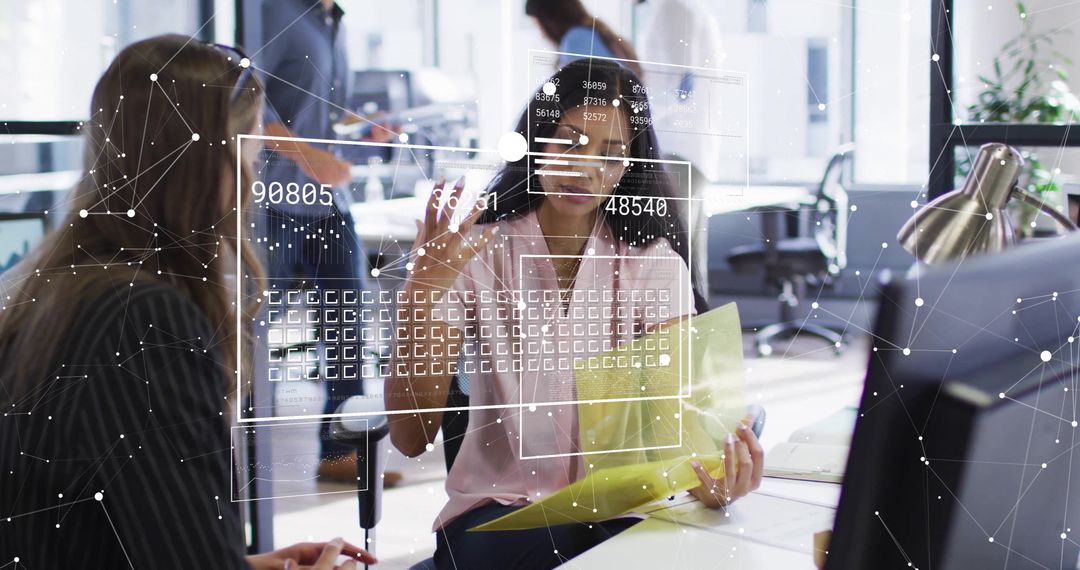 Diverse Business Team Collaborating with Financial Data in Office