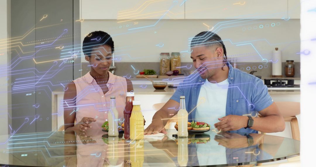 Couple reaching for condiments at kitchen table with futuristic circuit-style overlay