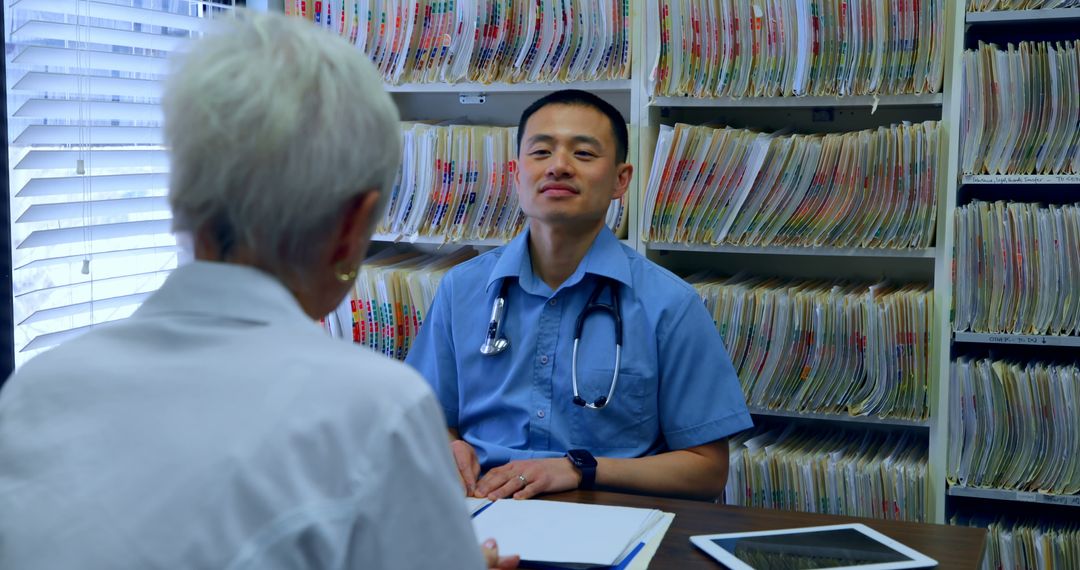 Senior Patient Speaking with Medical Doctor in Office - Free Images, Stock Photos and Pictures on Pikwizard.com