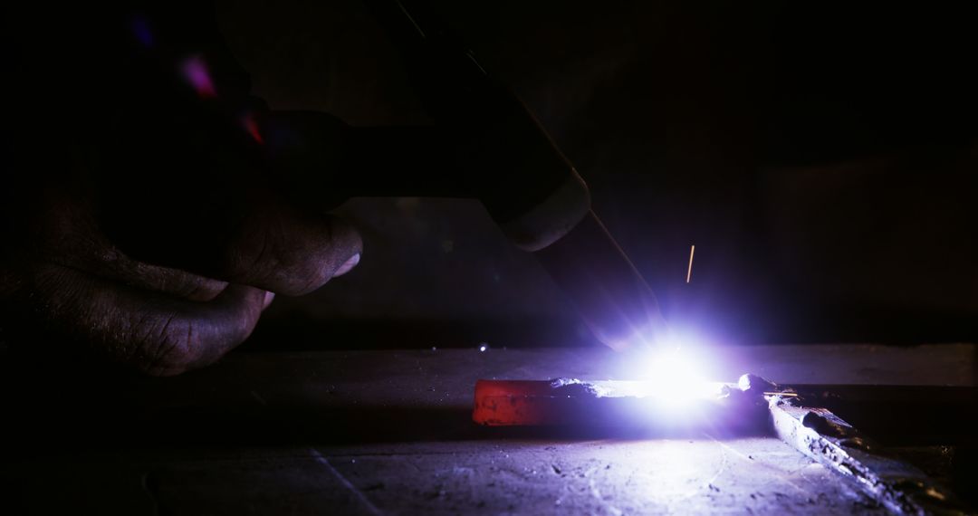 Close-up of Hand Using Welding Equipment with Intense Spark - Free Images, Stock Photos and Pictures on Pikwizard.com