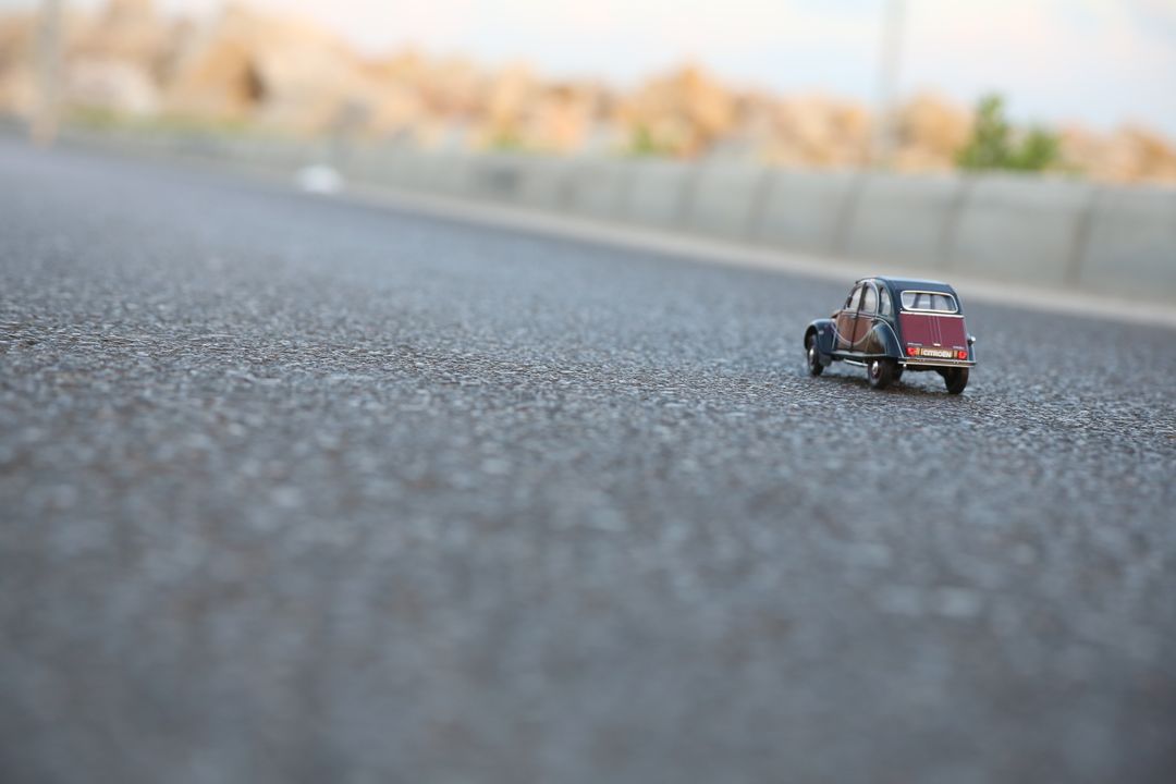 Miniature Model Car on Asphalt Road - Free Images, Stock Photos and Pictures on Pikwizard.com
