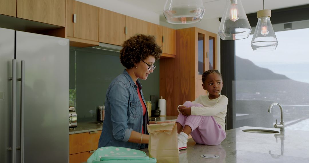 Mother and Daughter Bonding Over Lunch Prep in Modern Kitchen