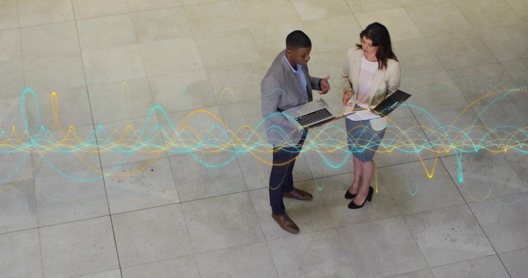 Business Professionals Analyzing Data with Digital Interface Hologram