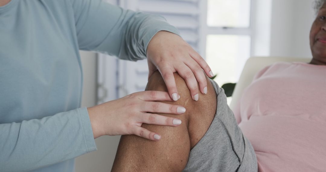 Medical Professional Examining Senior Patient's Knee in Clinic - Free Images, Stock Photos and Pictures on Pikwizard.com