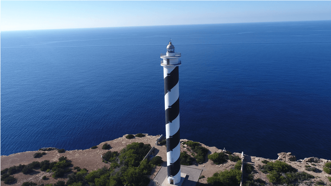 Elegant Black and White Lighthouse on Cliff with Vast Ocean View