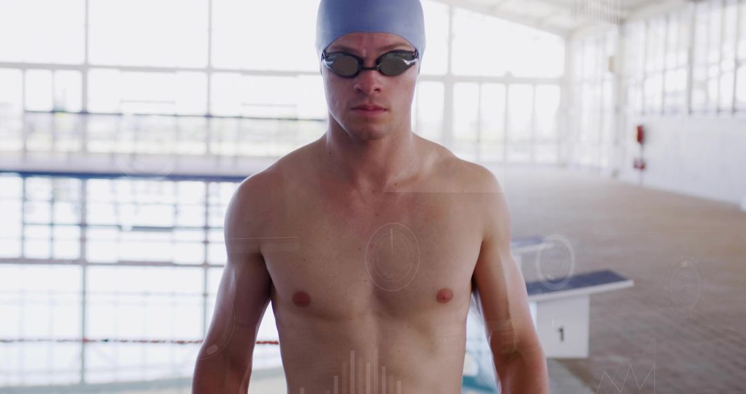 Male Competitive Swimmer Standing on Pool Deck Wearing Cap and Goggles Preparing to Race