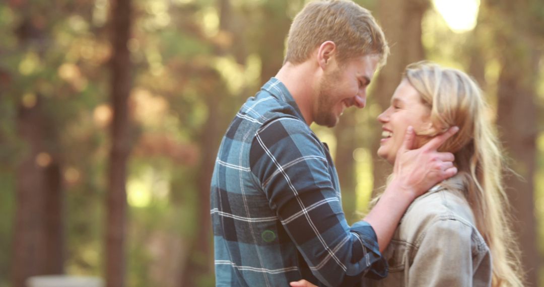 Loving Couple Embracing in Sunlit Forest Setting