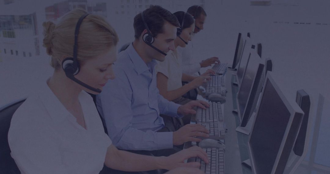 Customer Service Team Using Headsets in Modern Office Workspace