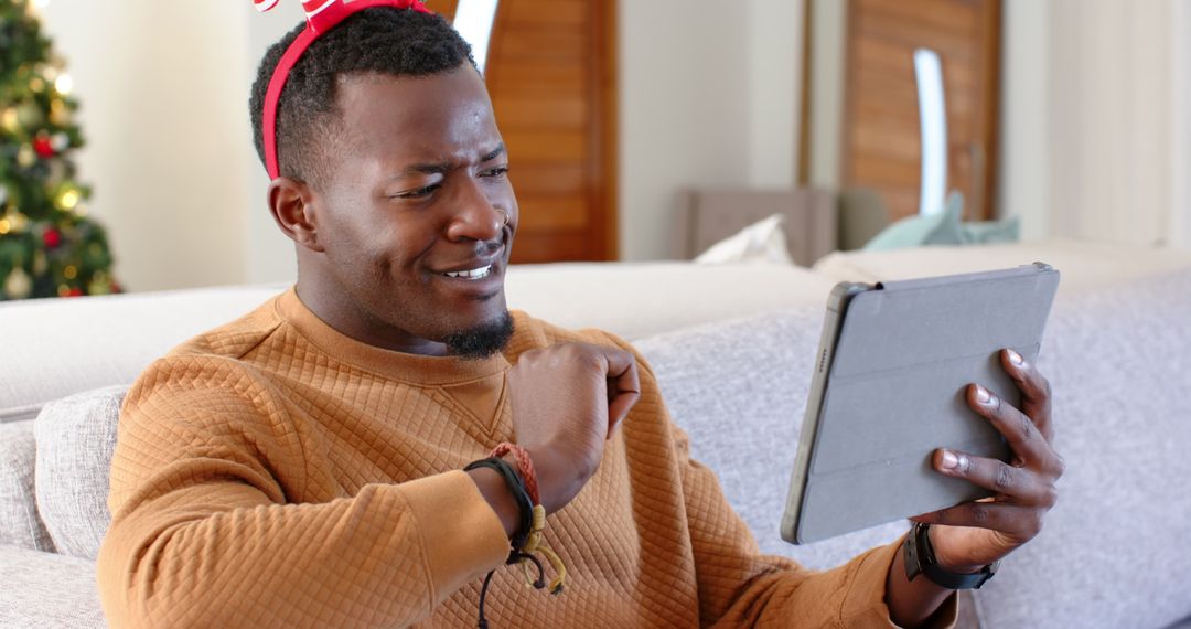 Festive Man Video Calling for Holiday Celebration