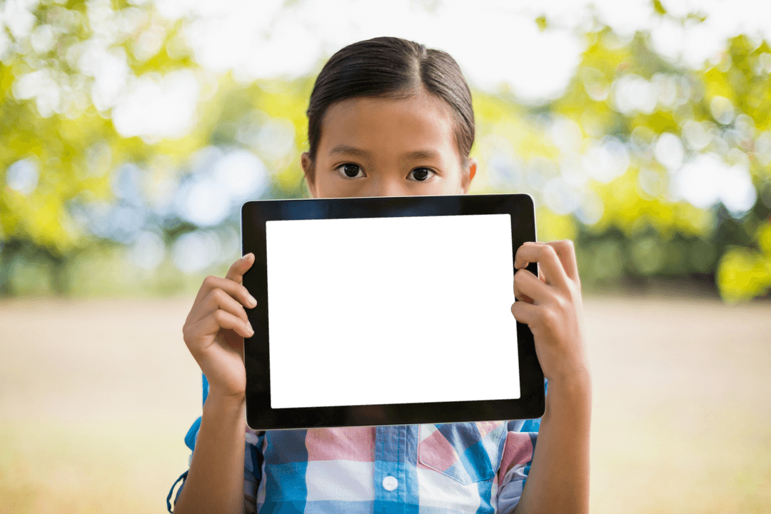 Girl Holding Transparent Tablet in Lush Green Park