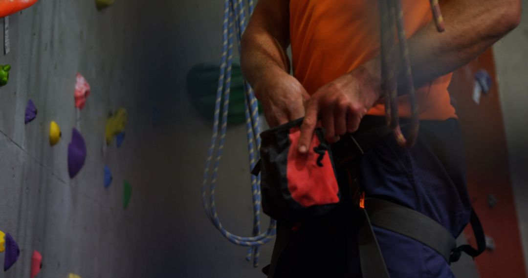 Indoor Climber Preparing for Climb with Chalk Bag and Harness - Free Images, Stock Photos and Pictures on Pikwizard.com