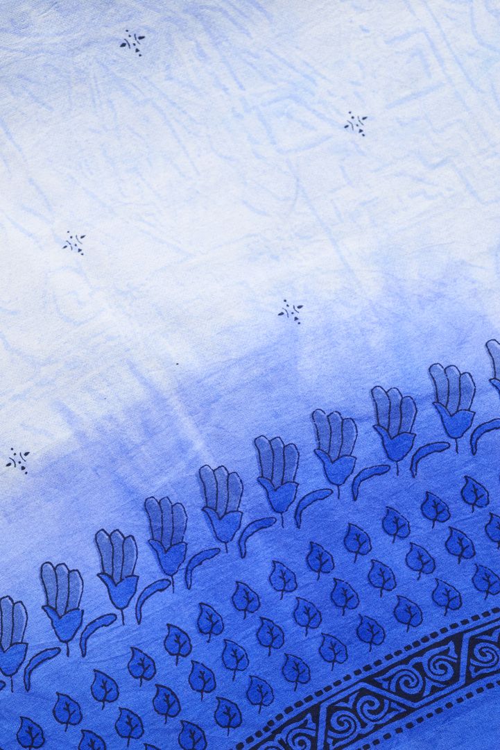 Indigo ombre cotton textile with hand block floral print, vine motifs and ornamental border