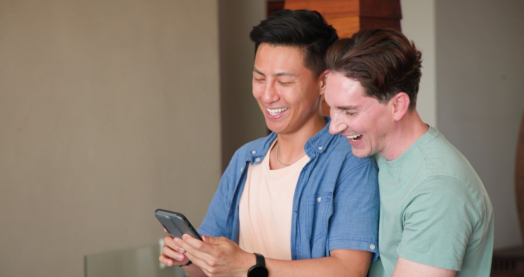 Joyful Couple Sharing Moments on Smartphone at Home, Happy Together