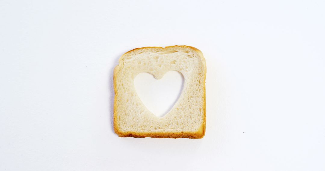 Slice of Bread with Heart-shaped Cutout on White Background - Free Images, Stock Photos and Pictures on Pikwizard.com