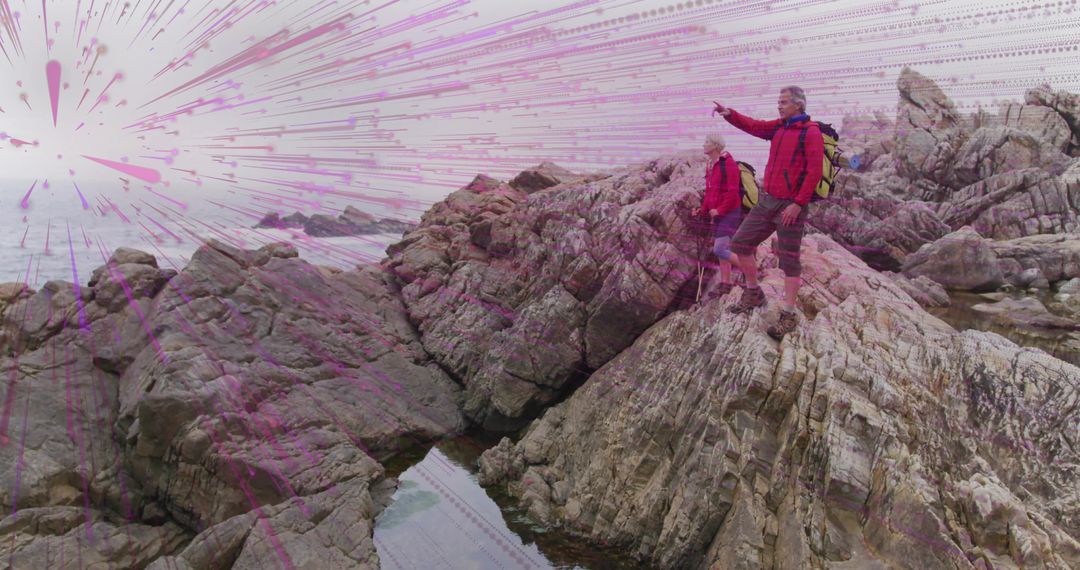 Adventurous Hikers Exploring Rocky Coast in Warm Attire
