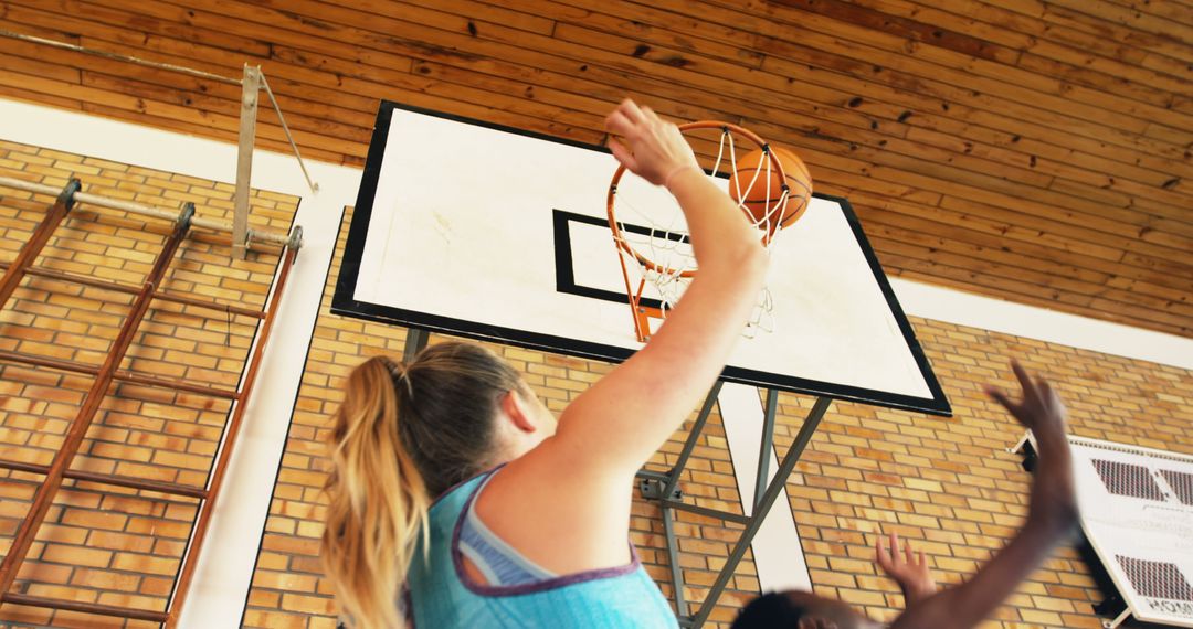 Teen Basketball Players Competing for the Ball Near Hoop - Free Images, Stock Photos and Pictures on Pikwizard.com