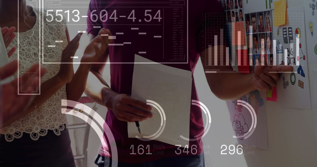 Team Collaborating on Financial Data Presentation at Office