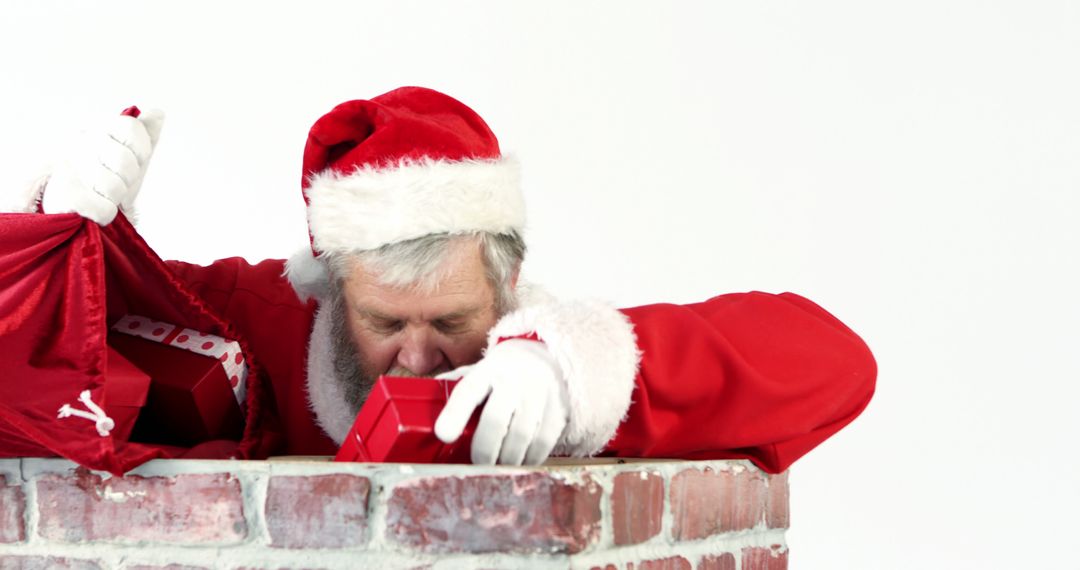 Santa Claus Delivering Gifts Through Chimney on Christmas Eve - Free Images, Stock Photos and Pictures on Pikwizard.com