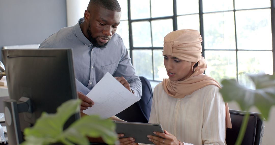 Effective Business Team Discussing Documents in Modern Office